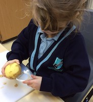 Child peeling potato